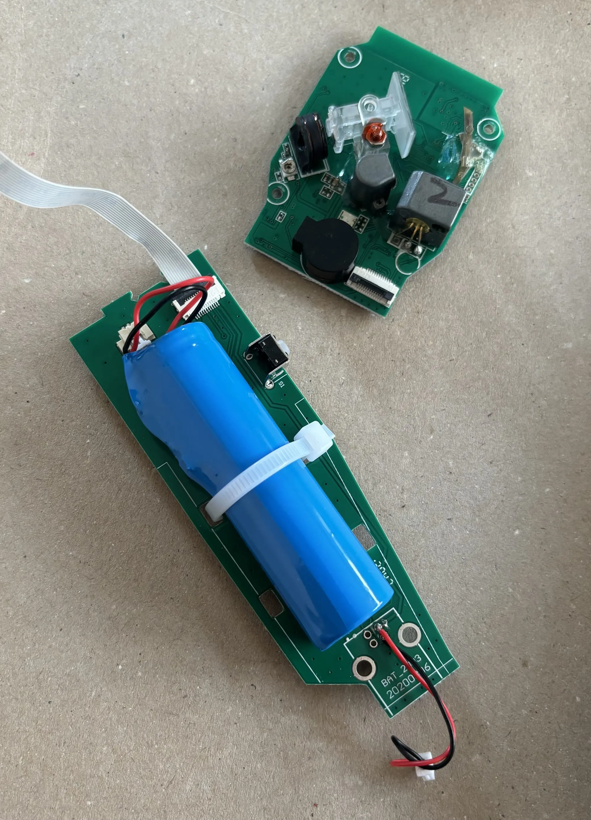 The barcode scanner even more disassembled with two circuit boards.