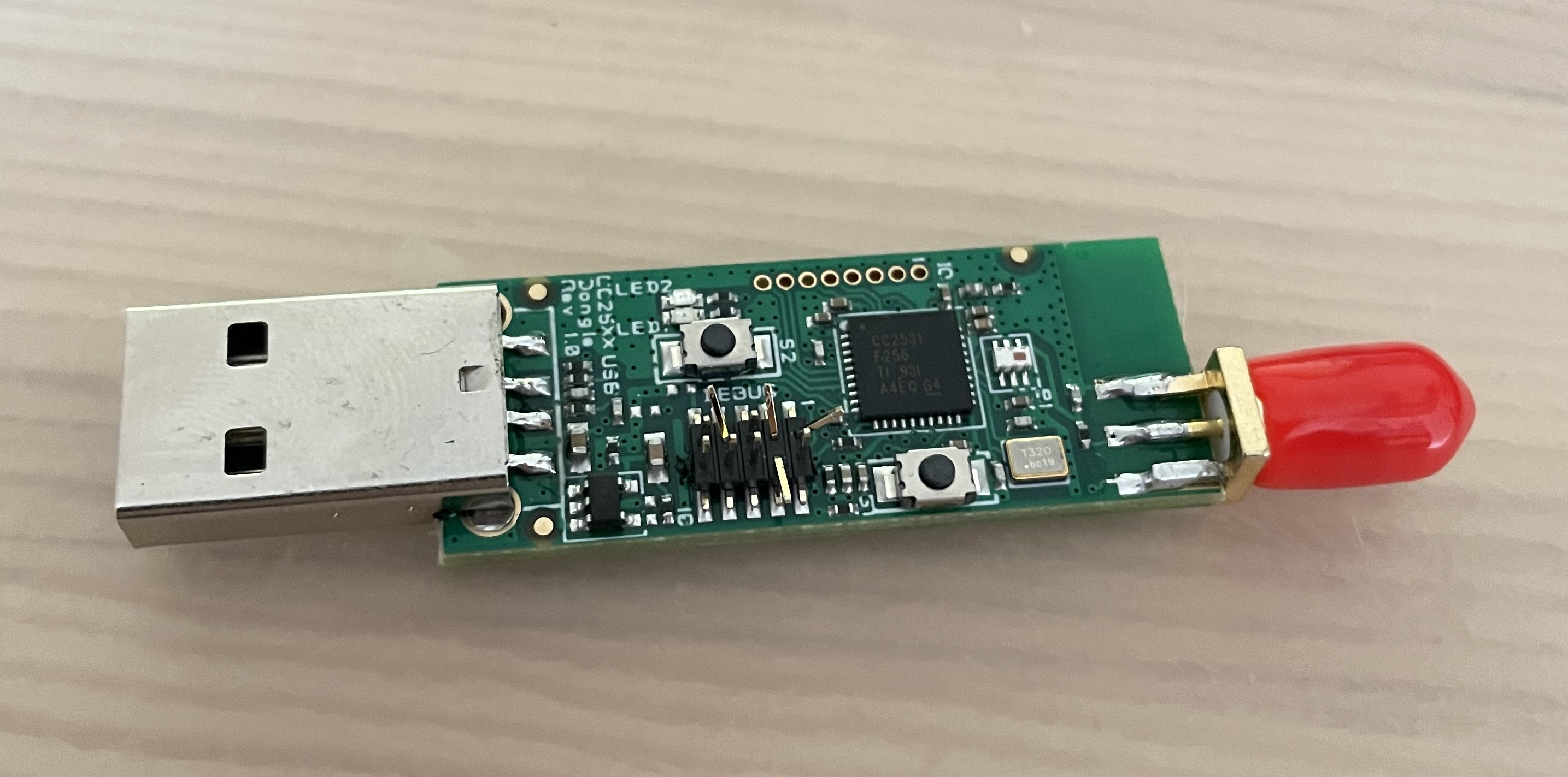 Photo showing the bent debug pins on the dongle