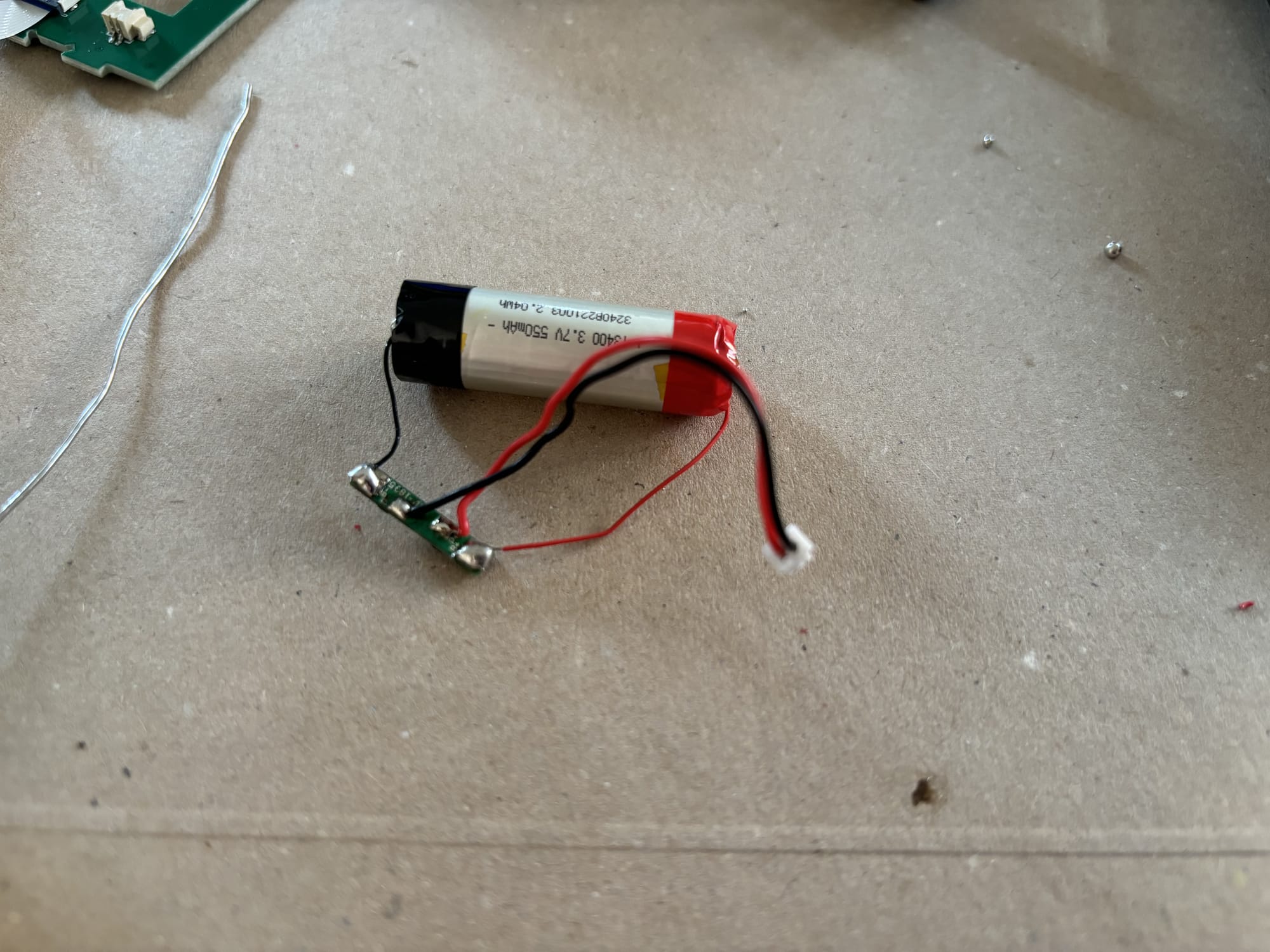 The battery protection circuit soldered onto the smaller battery.